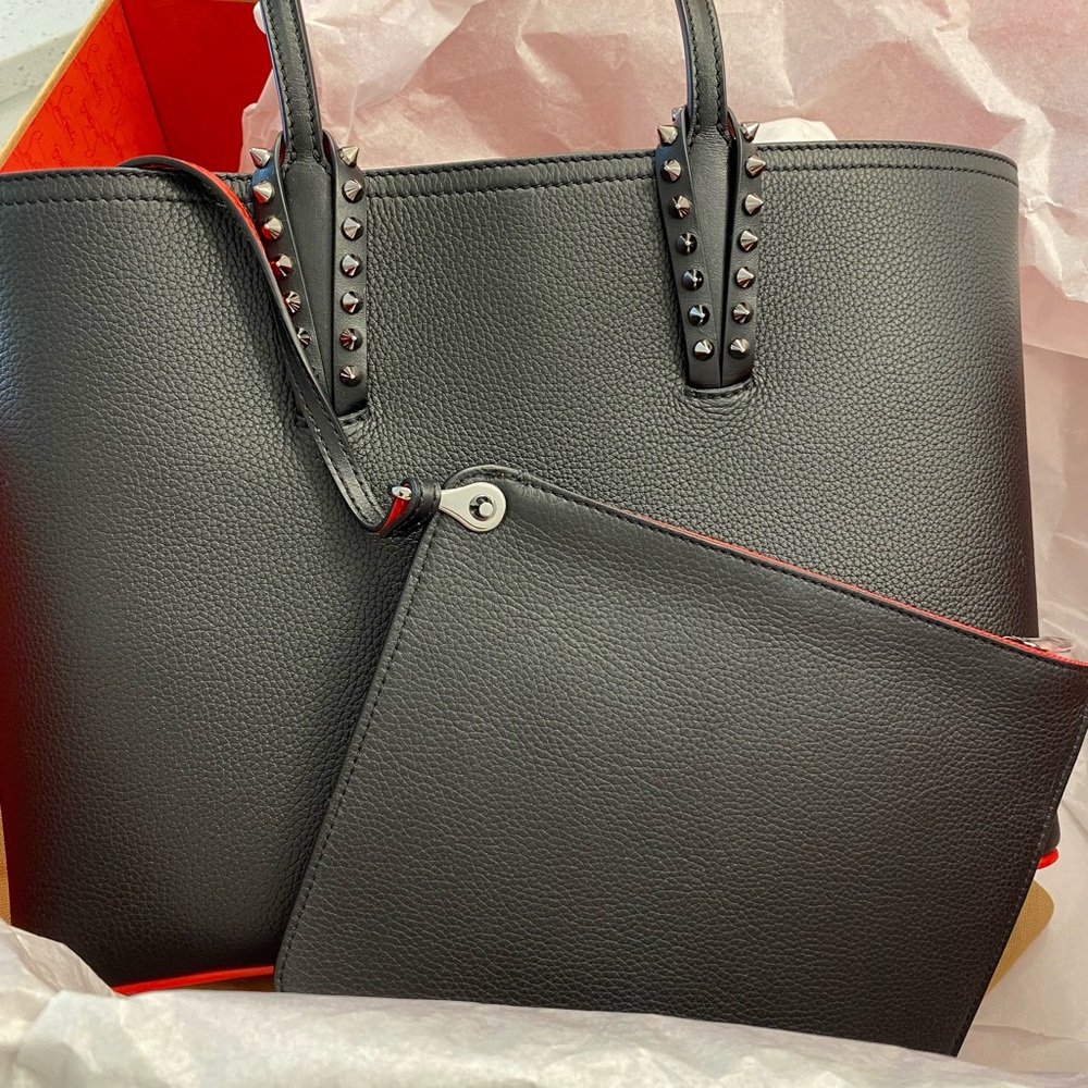 Brand New Christian Lou! The bag originally came from Neiman Marcus. Never used